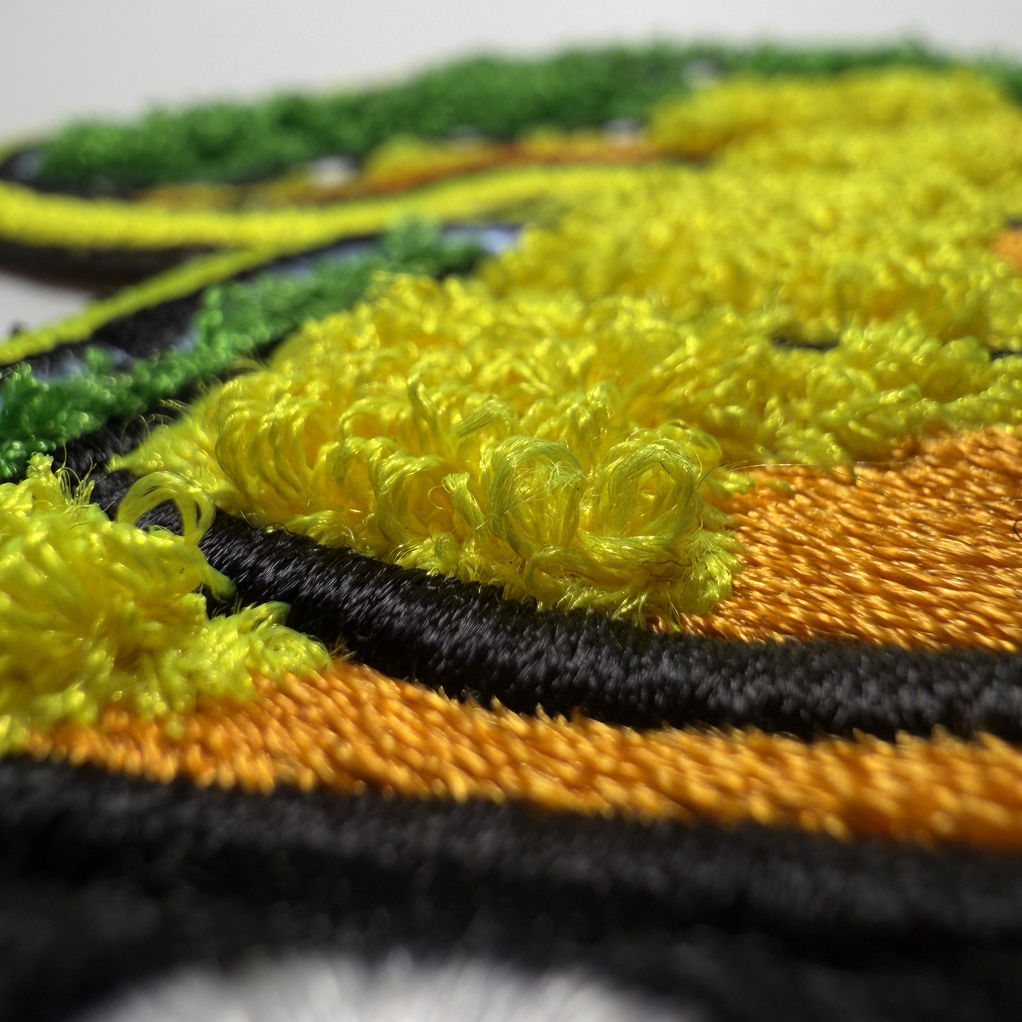 Détail d'un écusson chenille personnalisé